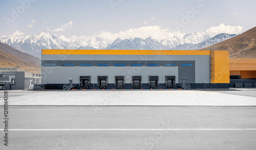 Large logistics building against the background of mountains