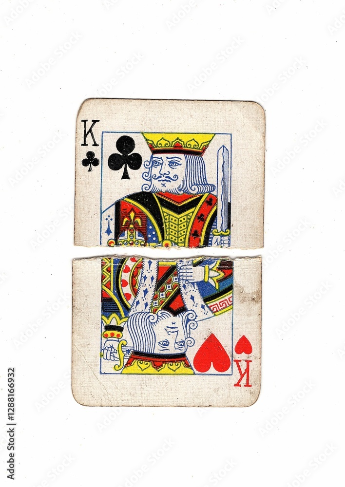 Obraz premium A king playing card made up of torn halves in different suits.