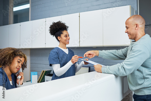 Reception Staff Assisting Patients in a Modern Dental Clinic Setting