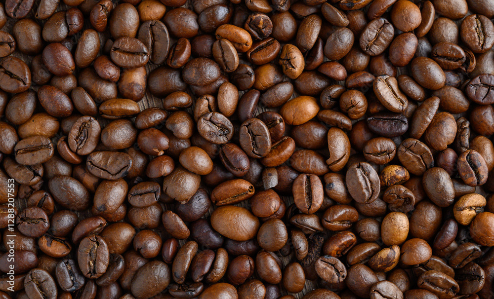 Exquisite coffee beans spilling over a wooden surface showcasing rich textures and shades of brown Exquisite coffee beans spilling over a wooden surface showcasing rich textures and shades of brown