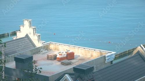 The back side of the facades of multi-storey buildings by the sea. Construction of residential, hotel and shopping complexes on the coast. photo