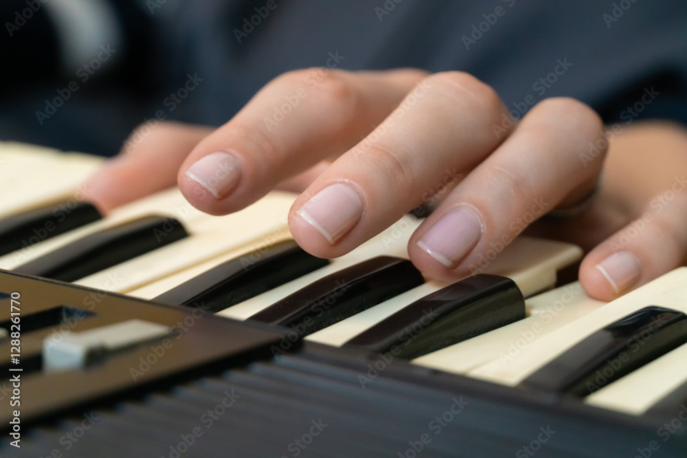 Fototapeta premium Fingers dancing over the keys of a vintage synthesizer, creating intricate melodies and rich electronic sounds, showcasing the skill and passion of a dedicated musician