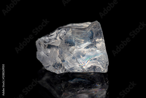 Natural rough girasol (milky) quartz gemstone on dark background (selective focus)