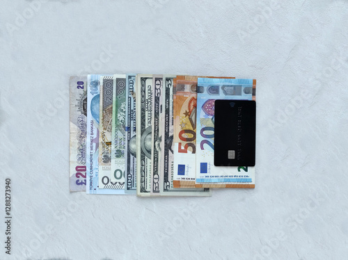 us dollar, euro, pound, zloty, lira banknotes and credit card photo