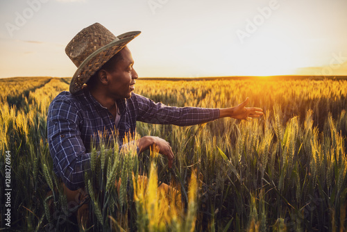 Papier peint Portrait of african farmer in his growing wheat field