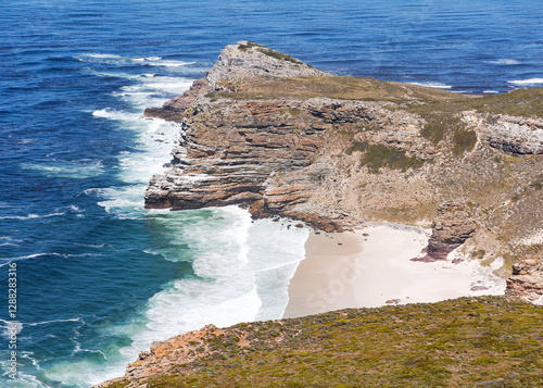 The rocky shore of Cape Agulhas, where the Indian and Atlantic Oceans meet, is a cape in South Africa, the southernmost point of Africa.