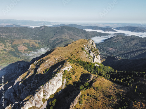 Misty Morning in the Romanian Mountains – Aerial View of Foggy Hills and Rocky Cliffs