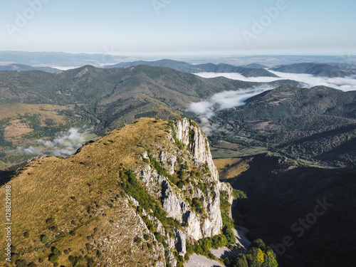 Misty Morning in the Romanian Mountains – Aerial View of Foggy Hills and Rocky Cliffs