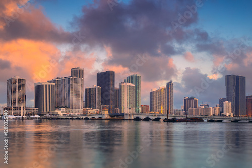 Miami, Florida, USA. Cityscape image of Miami, Florida with reflection of the city skyline in the water at beautiful sunrise.