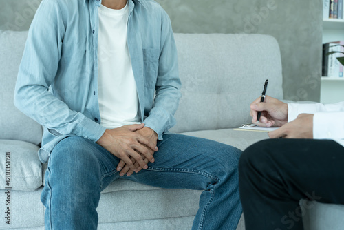 Man hold hand in front of private parts feeling discomfort and consult doctor. Venereal, testicular cancer. bladder problems, erectile dysfunction, premature ejaculation, prostate cancer