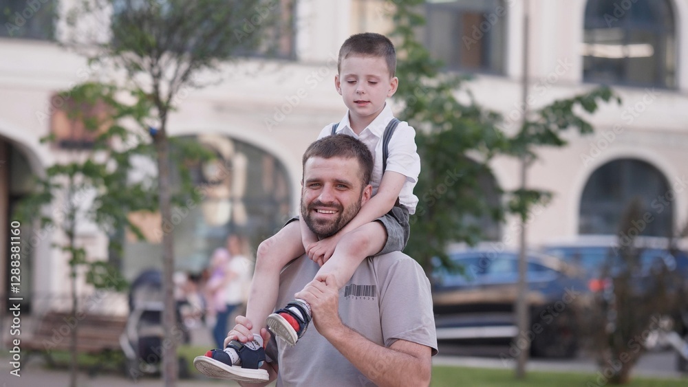 Happy father and young son portrait in the city in the summertime Happy father and young son portrait in the city in the summertime