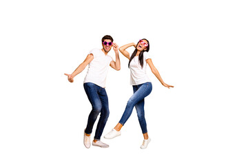 Full body photo of two people dancing at first season theme party wear cool specs and casual clothes isolated yellow color background
