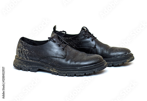 Pair of dirty classic shoes, boots after rain, isolated on white