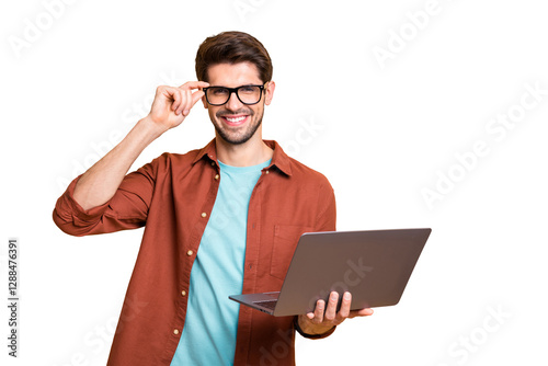 Portrait of his he nice attractive cheerful cheery successful content brunette guy holding in hands laptop working part-time touching specs isolated over beige color pastel background photo