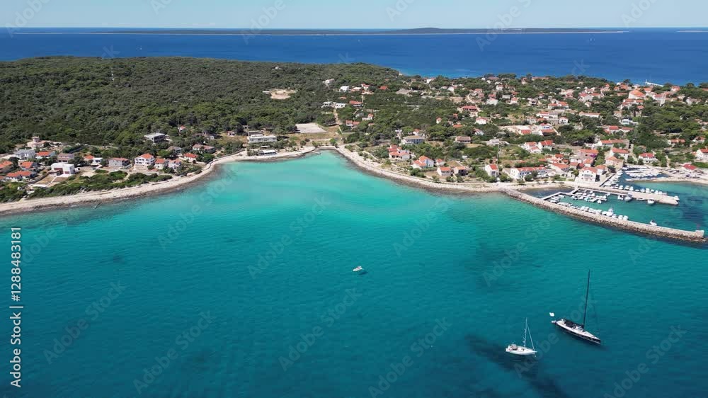 Aerial drone view of Croatian island Silba with beautiful beaches. Amazing Adriatic sea tourist vacation destination in Croatia. Panoramic paradise blue sea, sandy beaches, old houses and boats Aerial drone view of Croatian island Silba with beautiful beaches. Amazing Adriatic sea tourist vacation destination in Croatia. Panoramic paradise blue sea, sandy beaches, old houses and boats