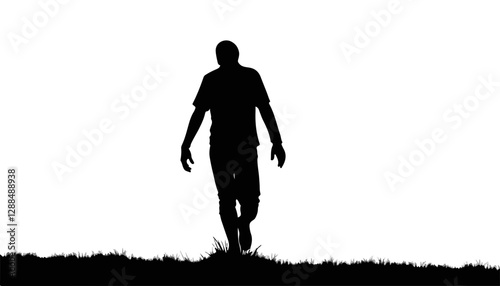 Silhouette of a person walking on grass