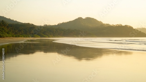 Tropical beach sunrise reflection, calm ocean, hill background, travel
