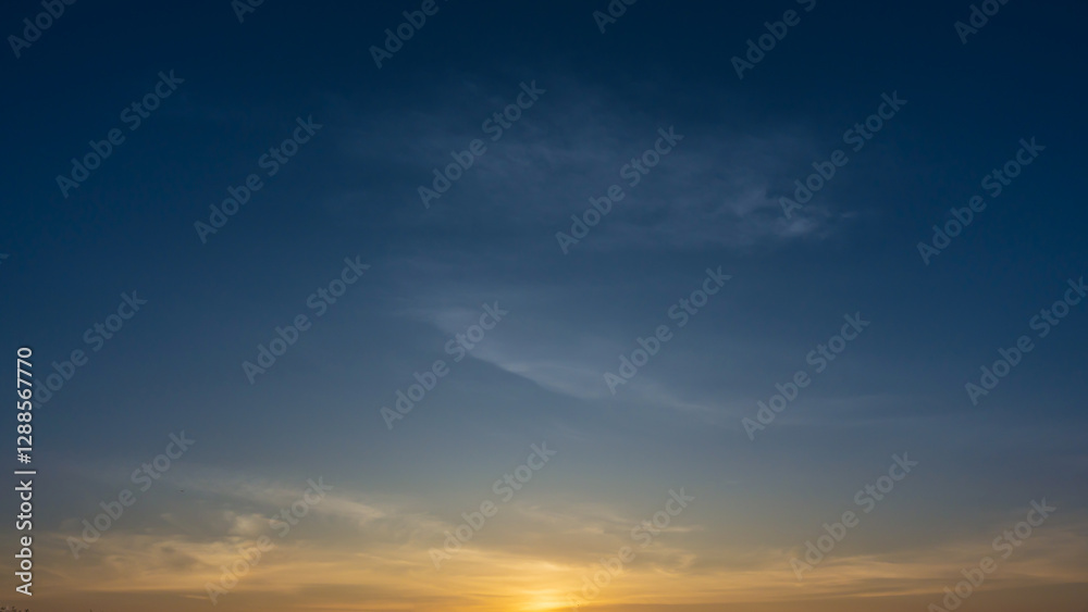 blue sky with soft wispy clouds at sunrise blue sky with soft wispy clouds at sunrise
