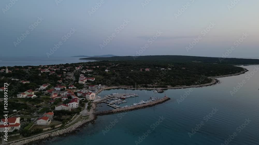 Aerial drone view of Croatian island Silba with beautiful beaches. Amazing Adriatic sea tourist vacation destination in Croatia. Panoramic paradise blue sea, sandy beaches, old houses and boats Aerial drone view of Croatian island Silba with beautiful beaches. Amazing Adriatic sea tourist vacation destination in Croatia. Panoramic paradise blue sea, sandy beaches, old houses and boats