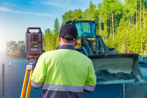 Man surveyor. Road construc...