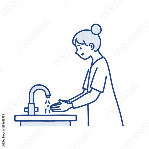 Person washing hands at sink