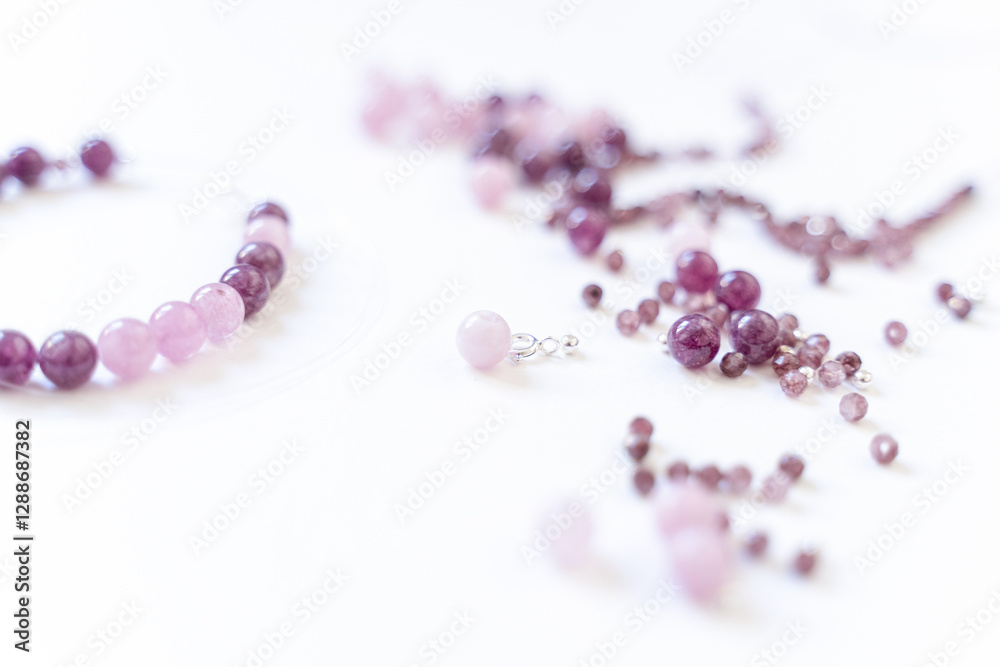 Preparing gemstone jewelry. Natural stones pink quartz, Amethyst, silver. Craft, handmade conception. Free space for text.