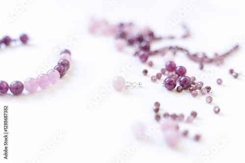Obraz na płótnie Preparing gemstone jewelry. Natural stones pink quartz, Amethyst, silver. Craft, handmade conception. Free space for text. w salonie