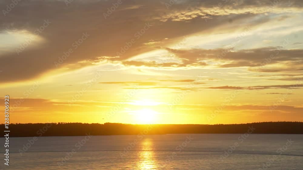 A magical golden sunset on a lagoon. Tibau do Sul, Brazil A magical golden sunset on a lagoon. Tibau do Sul, Brazil