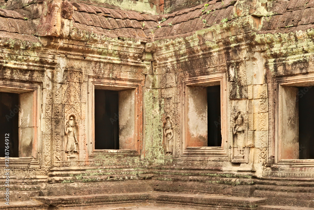 A row of windows at the Prasat Preah Khan Temple, apsaras carved into the stone in between, Angkor Wat, Siem Reap, Cambodia A row of windows at the Prasat Preah Khan Temple, apsaras carved into the stone in between, Angkor Wat, Siem Reap, Cambodia