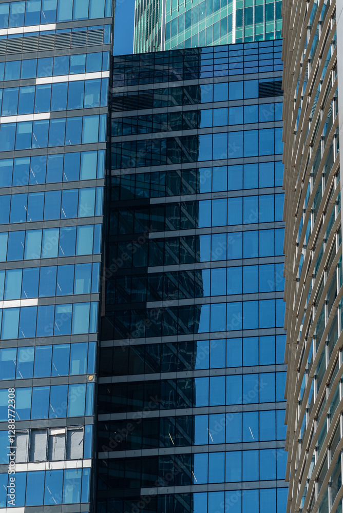 Broken windows of a skyscraper. Broken glass of an office building. Broken windows of a skyscraper. Broken glass of an office building.