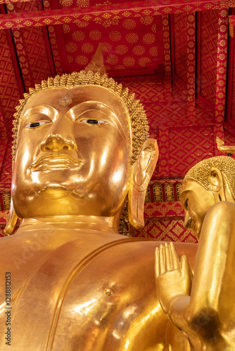 Big golden Buddha statue in a temple in Ayutthaya, Thailand. The golden Buddha statue of Sam Po Kong at Wat Phanan Choeng .