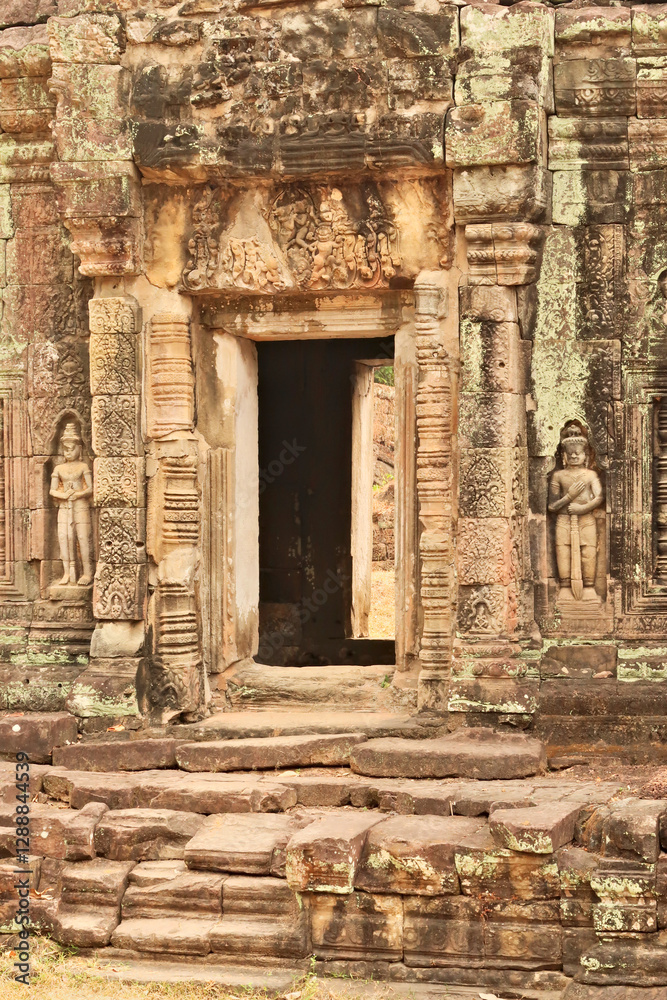 Elaborate doorway, door, gate, entrance at the Prasat Preah Khan Temple, flanked by two soldiers, warriors and ornaments carved into the sandstone, Angkor Wat, Siem Reap, Cambodia Elaborate doorway, door, gate, entrance at the Prasat Preah Khan Temple, flanked by two soldiers, warriors and ornaments carved into the sandstone, Angkor Wat, Siem Reap, Cambodia