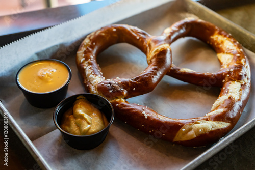 Large pretzel with sauces