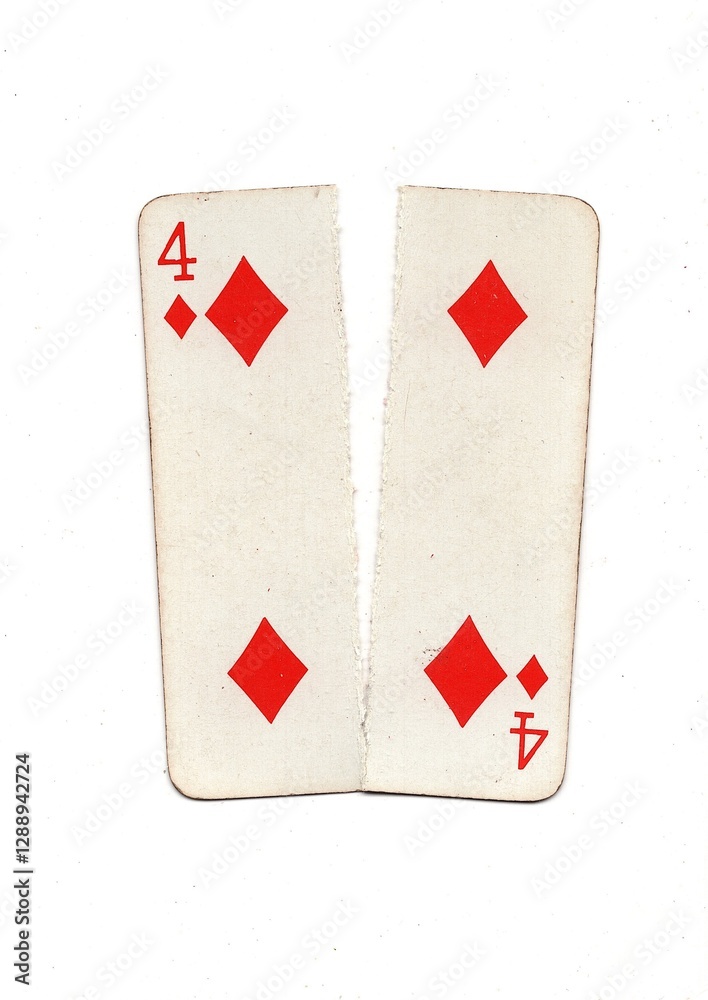 Obraz premium A vintage playing card torn in half from top to bottom on a white background.
