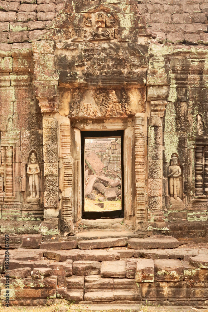 Elaborate doorway, door, gate, entrance at the Prasat Preah Khan Temple, flanked by two soldiers, warriors, ornaments carved into the sandstone, Angkor Wat, Siem Reap, Cambodia Elaborate doorway, door, gate, entrance at the Prasat Preah Khan Temple, flanked by two soldiers, warriors, ornaments carved into the sandstone, Angkor Wat, Siem Reap, Cambodia