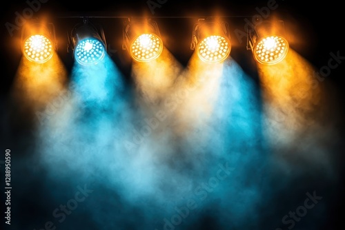 Obraz na płótnie Four stage spotlights emitting blue and amber light beams through a smoky atmosphere w salonie