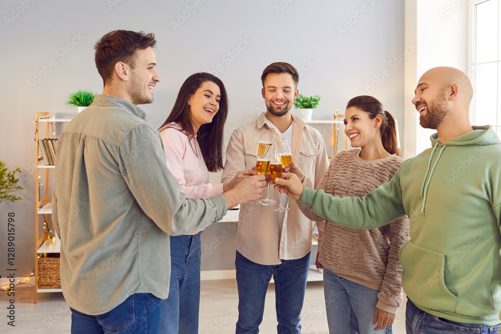Group of young friends toasting wine glasses and talking standing in a circle together at home. People cheering with glass of champagne celebrating birthday at home party. Celebration concept. Group of young friends toasting wine glasses and talking standing in a circle together at home. People cheering with glass of champagne celebrating birthday at home party. Celebration concept.