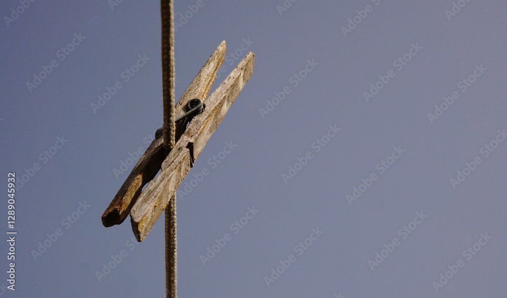 wooden clothespin against the sky wooden clothespin against the sky
