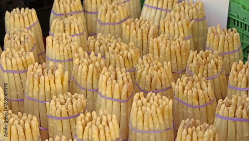 bunches of freshly picked white asparagus at the fruit vendor s stall
