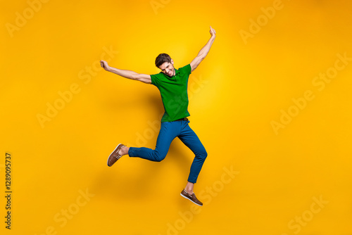 Full length body size photo of cheerful positive attrative man in blue pants trousers leather shoes flying jumping running up to his dream isolated over vivid color background photo