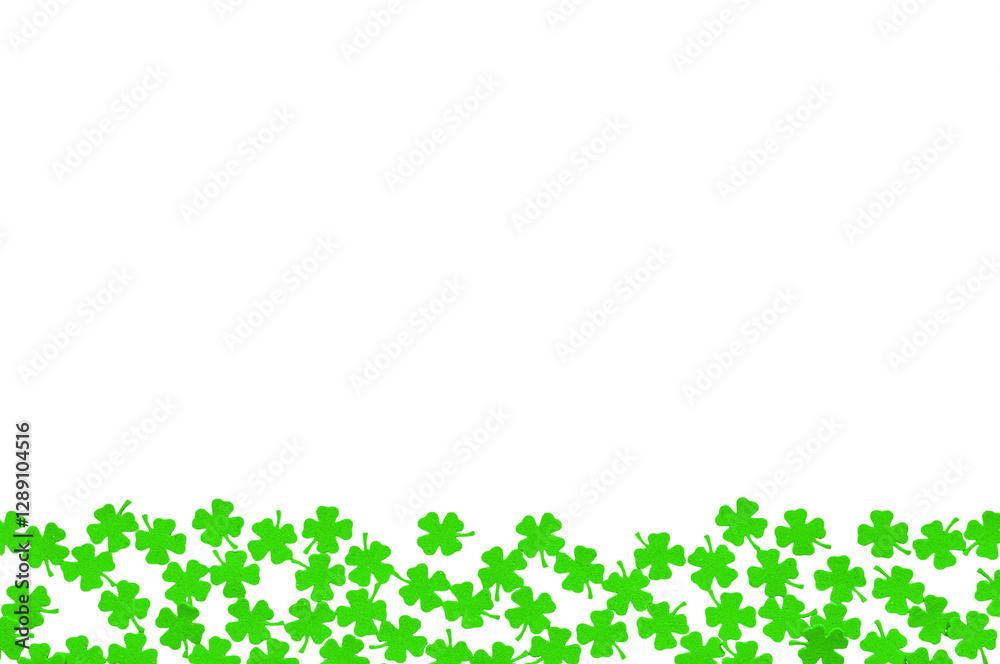 St Patricks Day background - borders of green quatrefoils on the white wooden surface, green shamrocks isolated on white, |St Patrick's day concept St Patricks Day background - borders of green quatrefoils on the white wooden surface, green shamrocks isolated on white, |St Patrick's day concept