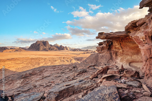 Obraz na płótnie Rocky desert landscape with strange looking rocks in arid Wadi Rum desert on a sunny day w salonie
