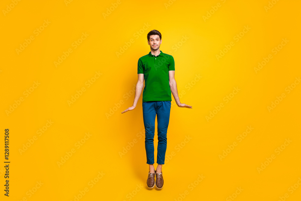© deagreez - Full length body size view of his he nice attractive funny playful childish guy jumping up isolated over bright vivid shine vibrant yellow color background