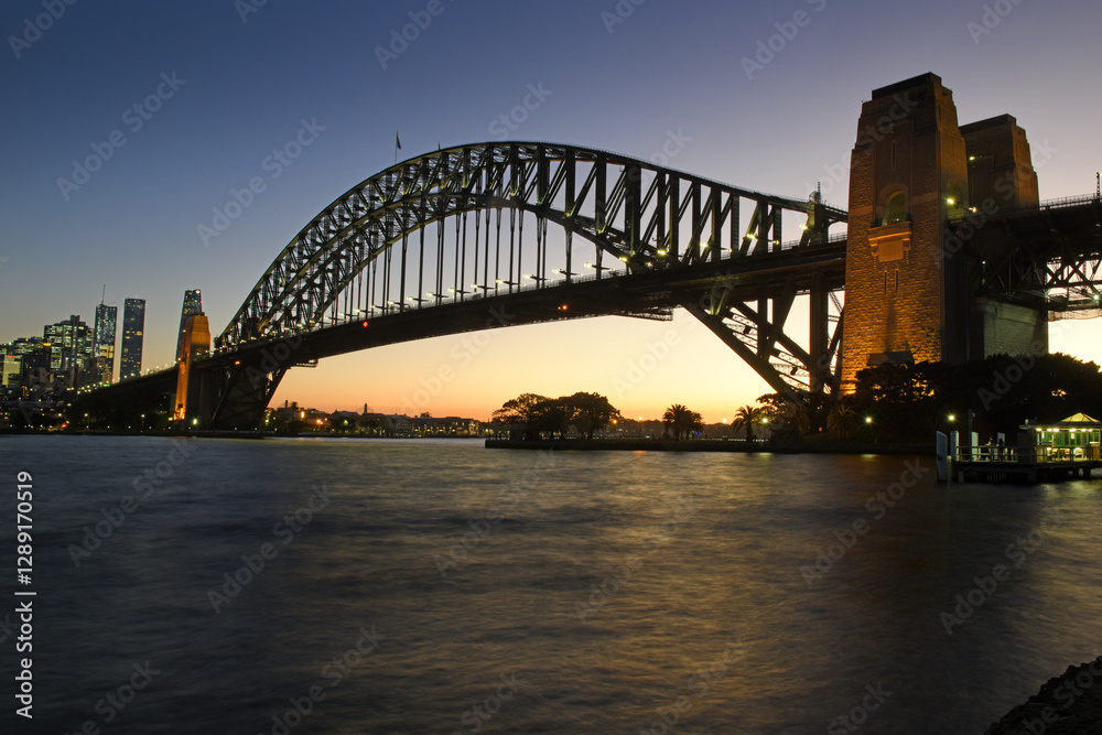 Naklejka premium view to the Sydney Harbour Bridge in Darling Harbour while sunset, Sydney, New South Wales, Australia 
