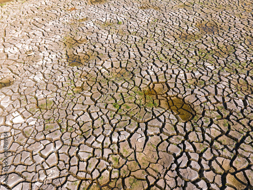 Dry and cracked ground land. Global warming and climate change. Environmental pollution by chemical waste.