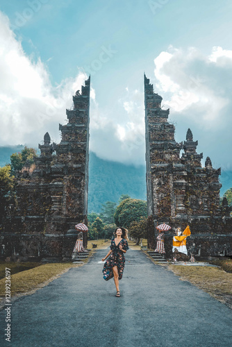 Wallpaper Mural Young Woman Running Through Handara Gate In Bali, Indonesia Torontodigital.ca