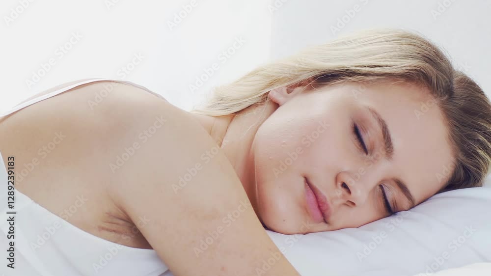 Peaceful, serene scene of a young woman sleeping comfortably in bed, with soft, natural lighting. Perfect for themes of relaxation, rest, and tranquility. Peaceful, serene scene of a young woman sleeping comfortably in bed, with soft, natural lighting. Perfect for themes of relaxation, rest, and tranquility.