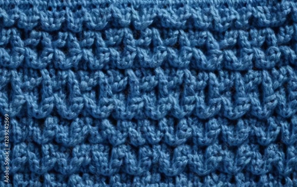 A close-up of a blue knitted woolen or cashmere fabric A close-up of a blue knitted woolen or cashmere fabric