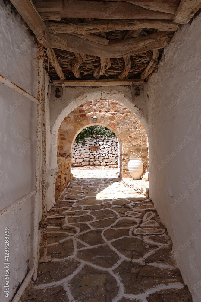 Fototapeta premium Picturesque main village of Kimolos island with beautiful cycladeic architecture built above of port Psathi, Cyclades, Greece