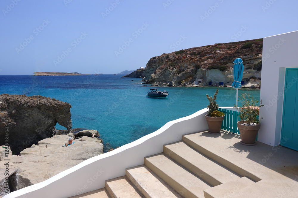 Fototapeta premium Picturesque seaside area and bay of Goupa - Karra with colourful boat houses a perfect place to swim, Kimolos island, Cyclades, Greece